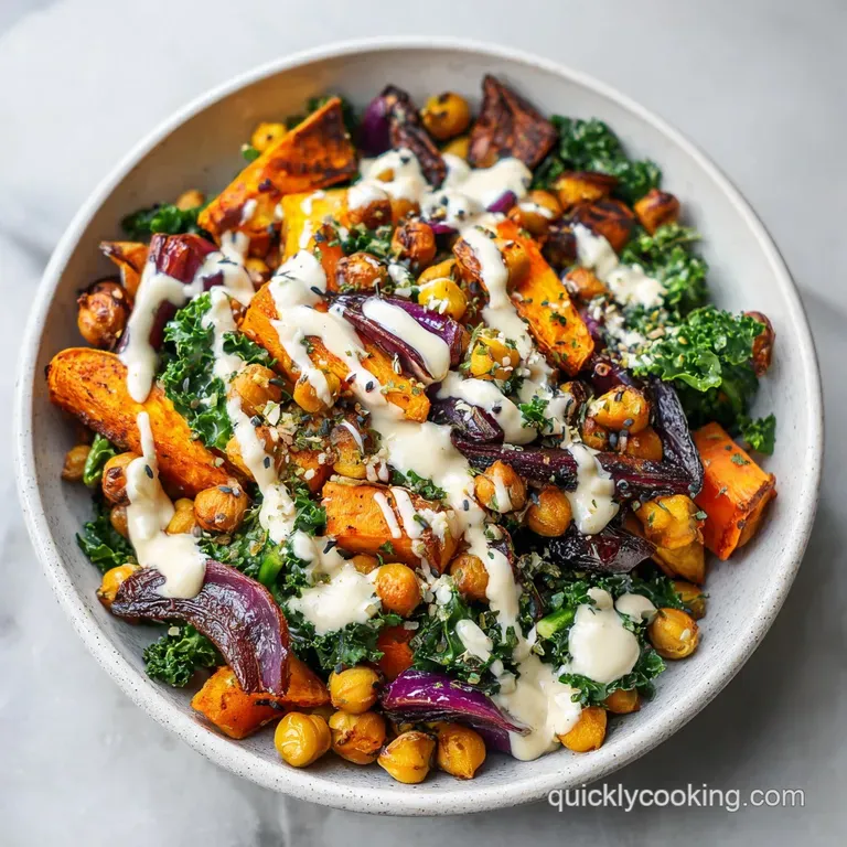 Artfully arranged vegan bowl. Jewel-toned vegetables, fluffy quinoa, and crisp greens with a rich, flowing tahini sauce.